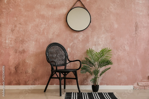 Stylish chair, houseplant a...