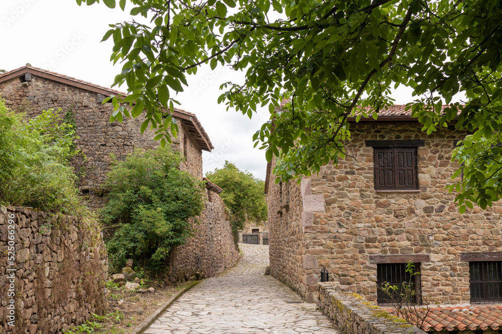 typical street and buildings in the village of barcena mayor in cantabria in northern spain