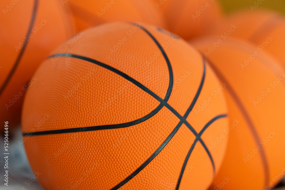 Many basketballs are placed in the gym for competition Many basketballs are placed in the gym for competition