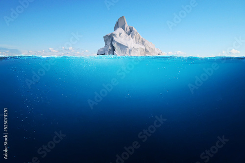 Beautiful white iceberg floats in the ocean with clear depth and views underwater. Melting glaciers, a concept. Global Warming