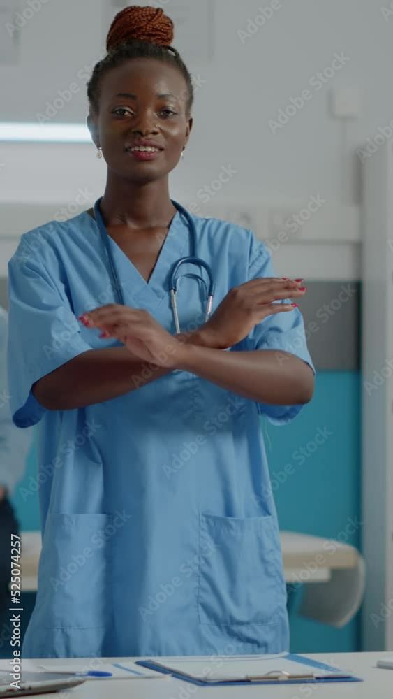 Vertical Video Portrait Of Medical Assistant Wearing Uniform Standing Vertical Video Portrait Of Medical Assistant Wearing Uniform Standing