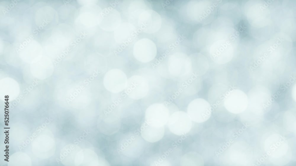 Defocused light christmas background of falling animated shiny particles Defocused light christmas background of falling animated shiny particles