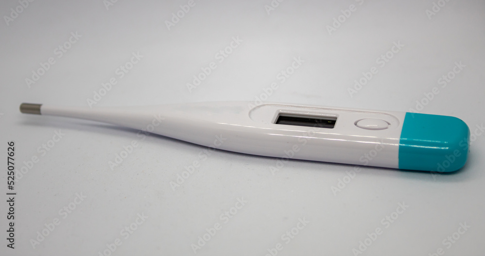 close up selective focus of blue white thermometer isolated on white background close up selective focus of blue white thermometer isolated on white background
