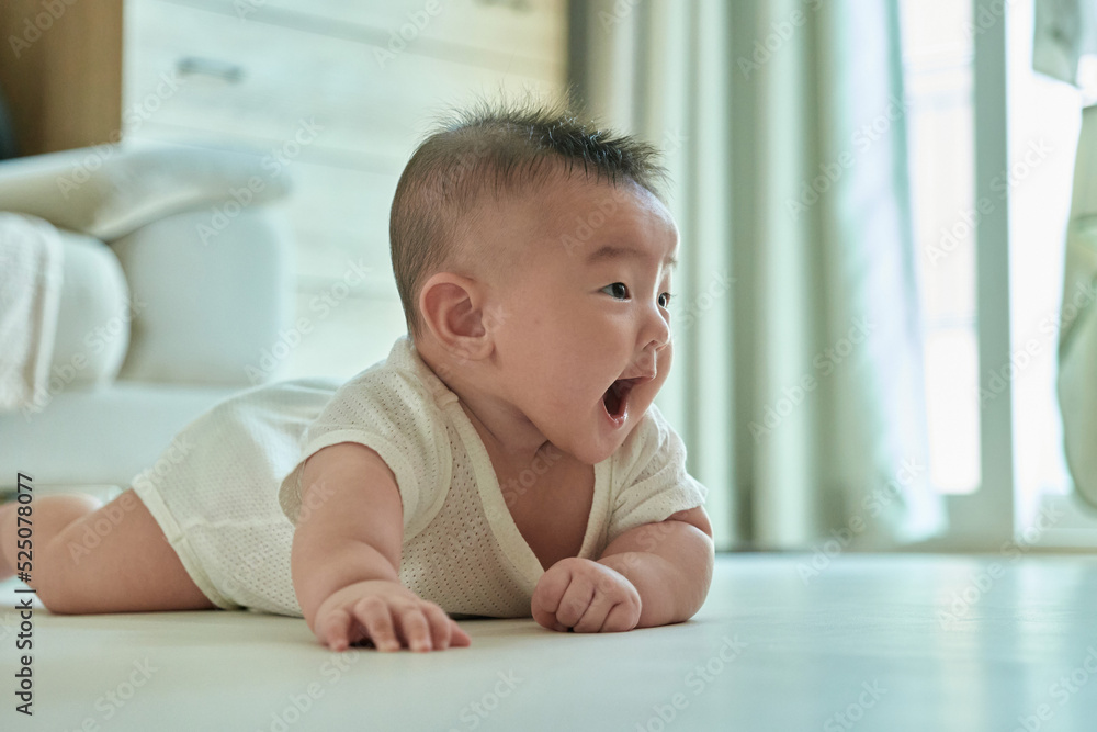 Smiling baby face crawling forward. Asian, Korean. Smiling baby face crawling forward. Asian, Korean.