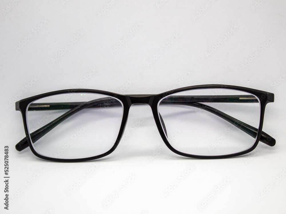 close up selective focus of black framed glasses isolated on white background close up selective focus of black framed glasses isolated on white background