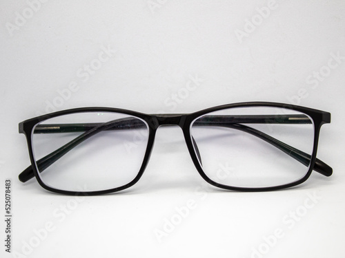 close up selective focus of black framed glasses isolated on white background photo