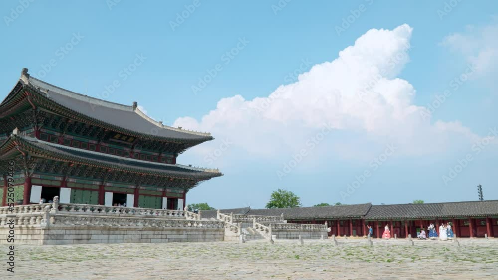 Group Of Women In Traditional Hanbok Dress Near Geunjeongjeon Throne Hall In Gyeongbokgung Palace, Seoul, South Korea - wide Group Of Women In Traditional Hanbok Dress Near Geunjeongjeon Throne Hall In Gyeongbokgung Palace, Seoul, South Korea - wide
