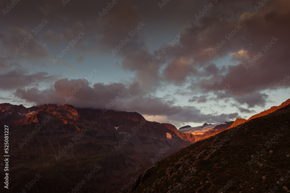 Awesome sunset panorama of the Gepatschferner on the border between Italy and Austria. Punta del Lago Bianco covered of clouds is visible. Vallelunga, Alto Adige, Italy