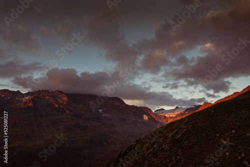 Awesome sunset panorama of the Gepatschferner on the border between Italy and Austria. Punta del Lago Bianco covered of clouds is visible. Vallelunga, Alto Adige, Italy
