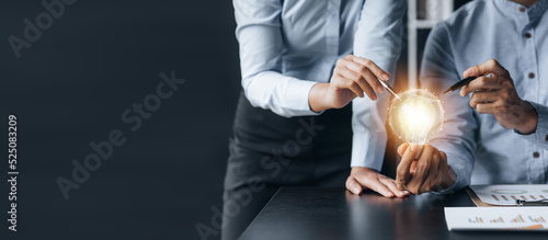 Photos Businessman holds a glowing lamp, Creative new idea