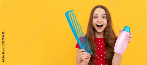 amazed teen girl has long hair hold hair brush and lotion. Kid girl hair care  horizontal poster. Banner header with copy space.