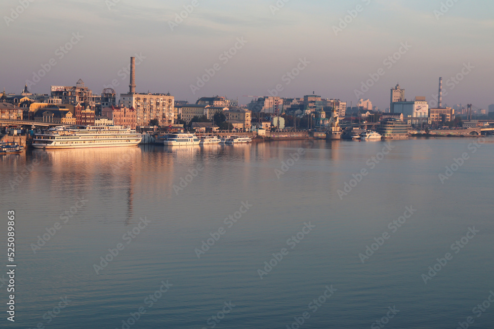 Aerial view of Podol and Dnipro river in the early morning. River port, Postal area. View from Pedestrian Bridge to the waterfront in Podil.