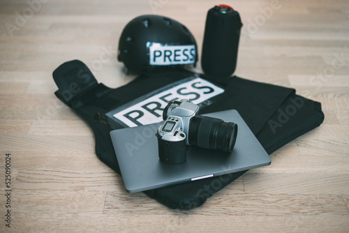 Slika na platnu Camera, bulletproof vest, laptop, lens, helmet, photojournalist concept