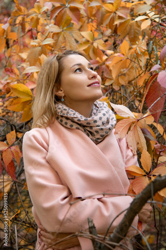 beautiful woman in autumn park with yellow leaves