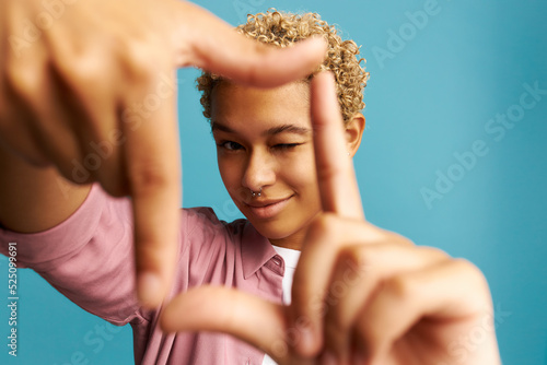 Fotografie Selective focus on hands of young creative african american millennial girl with