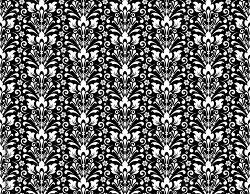 Wallpaper in the style of Baroque. Seamless vector background. White and black floral ornament. Graphic pattern for fabric, wallpaper, packaging. Ornate Damask flower ornament