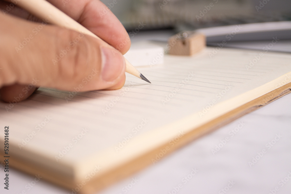 hand hold pencil write on paper note concept education or work job at office hand hold pencil write on paper note concept education or work job at office