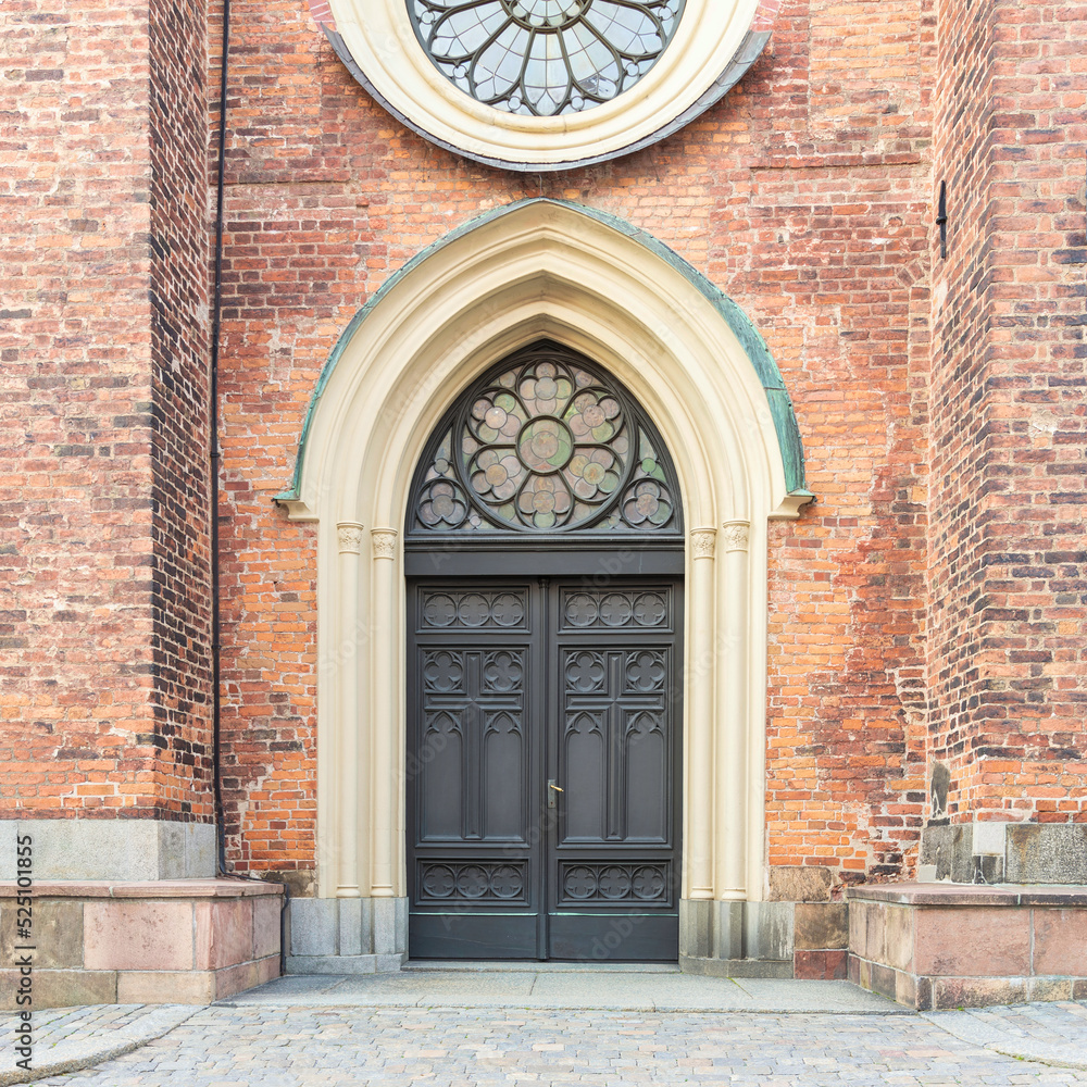 Entrance of Riddarholmen Church, located in the island of Riddarholmshamnen, old city, Gamla stan. before sunset in a summer day, Stockholm, Sweden