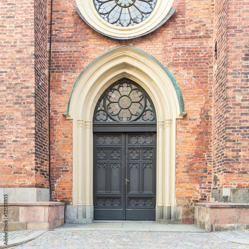 Entrance of Riddarholmen Church, located in the island of Riddarholmshamnen, old city, Gamla stan. before sunset in a summer day, Stockholm, Sweden photo