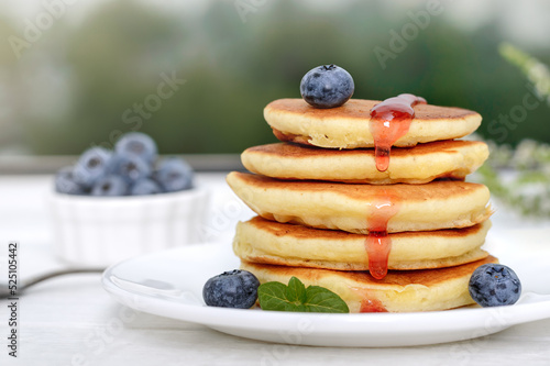 American pancakes with berries and jam. Sweet tasty breakfast, dessert.