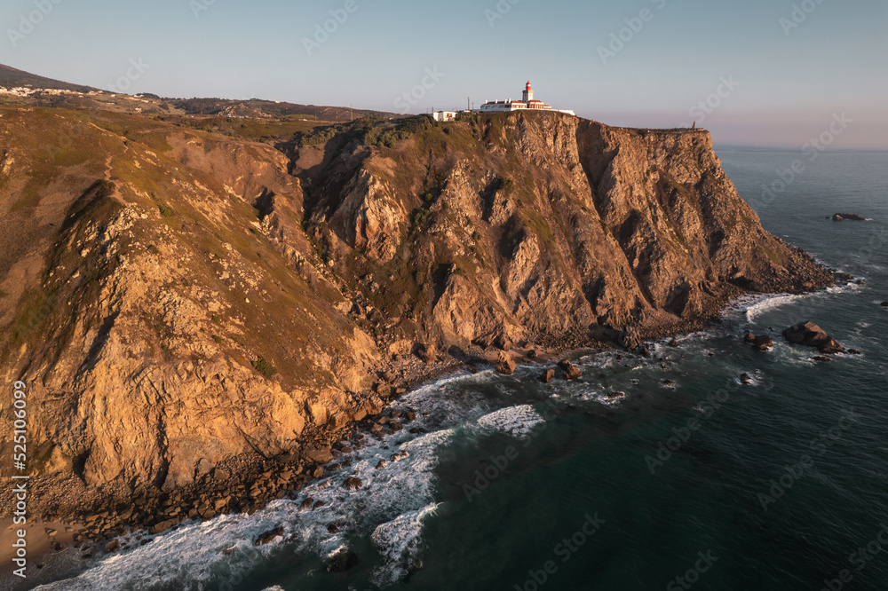 Cliff with lighthouse near sea