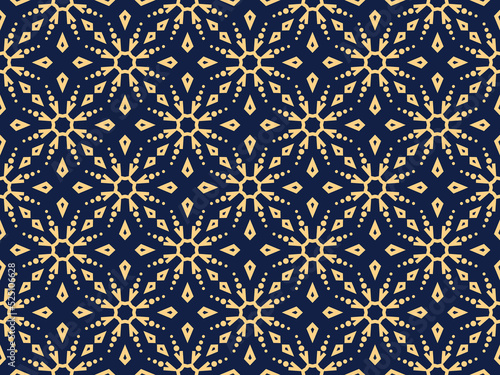 Abstract geometric pattern with lines, snowflakes. A seamless vector background. Gold and dark blue texture. Graphic modern pattern