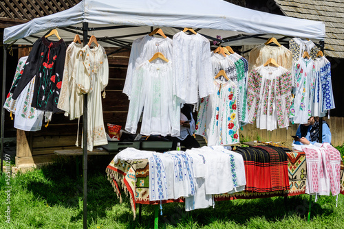 Traditional Romanian hand made clothes displayed for sale at a hand made festival in Bucharest, Romania.