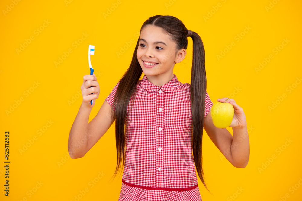 Girl cleaning teeth. Kid brushing teeth with brush. Dental hygiene, tooth care. Girl cares about health of his teeth. Happy teenager, positive and smiling emotions of teen girl.