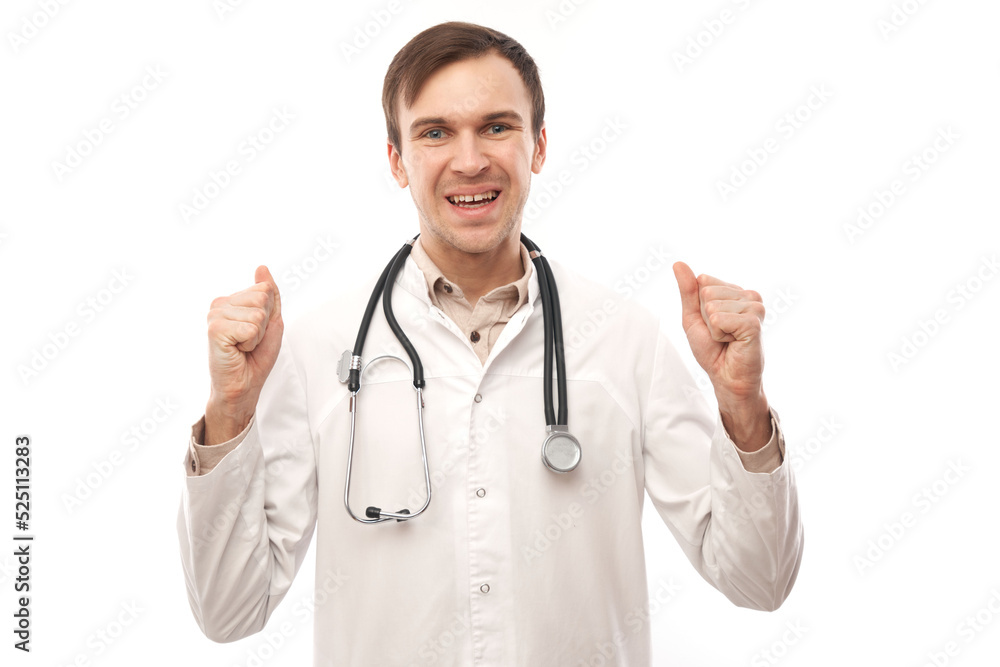Portrait of a happy doctor in white medical coat emotionally rejoices isolated on white background with copy space Portrait of a happy doctor in white medical coat emotionally rejoices isolated on white background with copy space