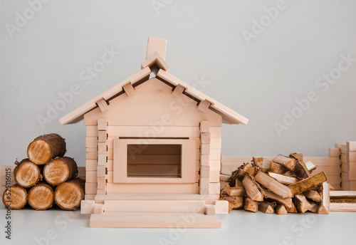 heating of a private wooden house with firewood in the cold season in winter and autumn