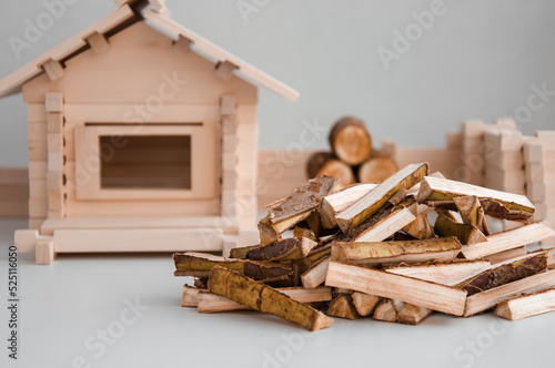 heating of a private wooden house with firewood in the cold season in winter and autumn