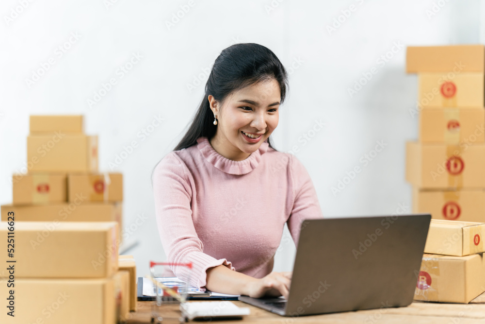 Starting small businesses SME owners female entrepreneurs check online orders to prepare to pack the boxes, sell to customers, sme business ideas online. Starting small businesses SME owners female entrepreneurs check online orders to prepare to pack the boxes, sell to customers, sme business ideas online.