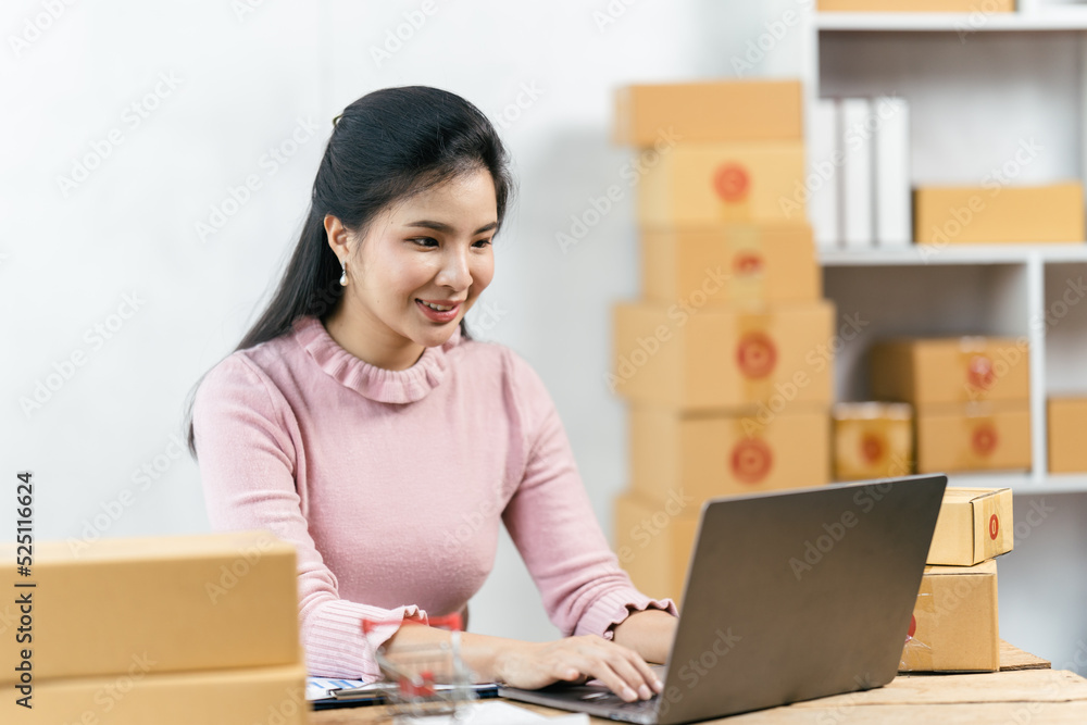 Starting small businesses SME owners female entrepreneurs check online orders to prepare to pack the boxes, sell to customers, sme business ideas online. Starting small businesses SME owners female entrepreneurs check online orders to prepare to pack the boxes, sell to customers, sme business ideas online.