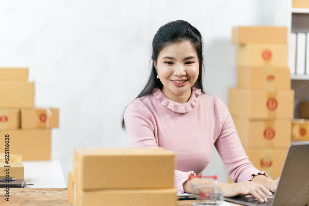 Starting small businesses SME owners female entrepreneurs check online orders to prepare to pack the boxes, sell to customers, sme business ideas online. Starting small businesses SME owners female entrepreneurs check online orders to prepare to pack the boxes, sell to customers, sme business ideas online.