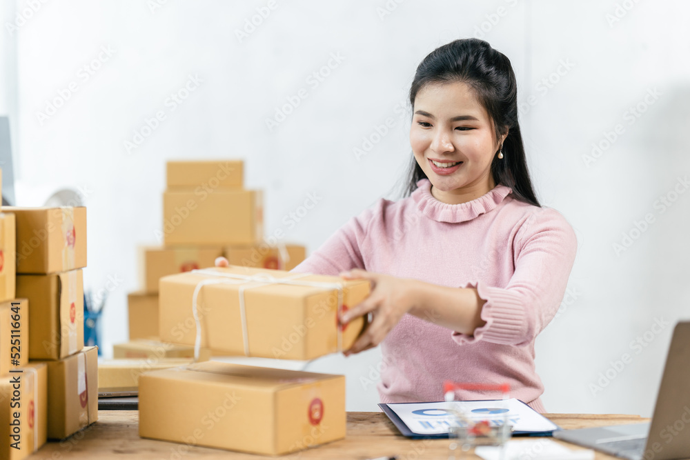 Starting small businesses SME owners female entrepreneurs check online orders to prepare to pack the boxes, sell to customers, sme business ideas online. Starting small businesses SME owners female entrepreneurs check online orders to prepare to pack the boxes, sell to customers, sme business ideas online.