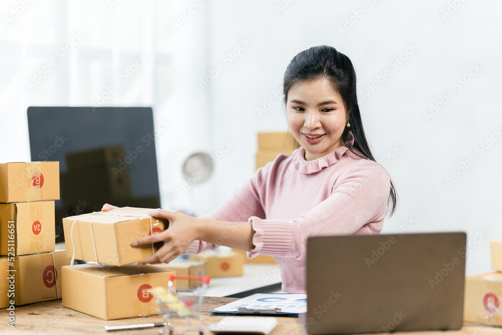Starting small businesses SME owners female entrepreneurs check online orders to prepare to pack the boxes, sell to customers, sme business ideas online. Starting small businesses SME owners female entrepreneurs check online orders to prepare to pack the boxes, sell to customers, sme business ideas online.