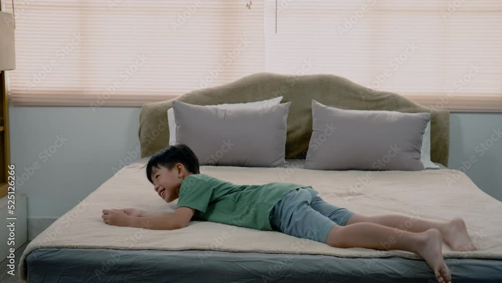 4K, Slow, Asian boy, handsome, The boy was wearing a green t-shirt, jumping up and down on his soft bed in a good mood, He jumped and lay himself down on a soft bed, and lie down on bed peacefully. 4K, Slow, Asian boy, handsome, The boy was wearing a green t-shirt, jumping up and down on his soft bed in a good mood, He jumped and lay himself down on a soft bed, and lie down on bed peacefully.