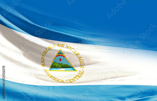 Nicaragua national flag cloth fabric waving on the sky - Image