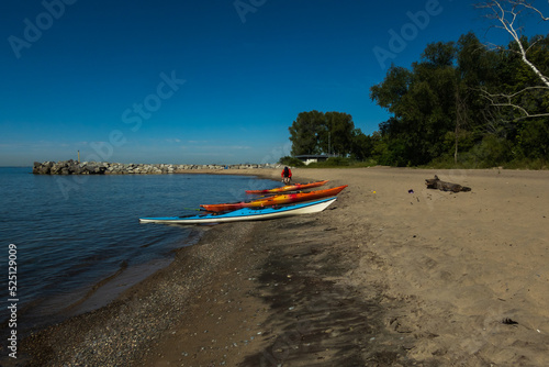 Kayaks beached in the early morning on Toronto's Centre Island. Shot in summer.