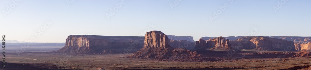 Desert Rocky Mountain American Landscape. Morning Sunny Sunrise Sky. Oljato-Monument Valley, Utah, United States. Nature Background Panorama