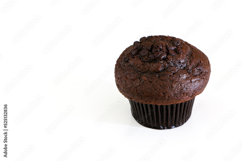 High angle shot of double chocolate muffin cake on the right, isolated by white background High angle shot of double chocolate muffin cake on the right, isolated by white background
