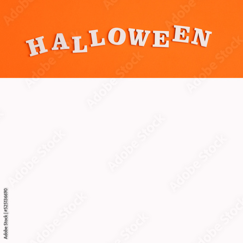 Word Halloween in white letters on orange background