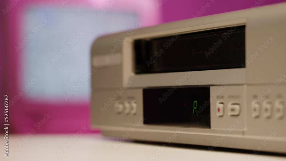 Old video recorder close-up, VHS. Retro player, video cassette broadcasting, audio tape. Watching vintage television. Old video recorder close-up, VHS. Retro player, video cassette broadcasting, audio tape. Watching vintage television.