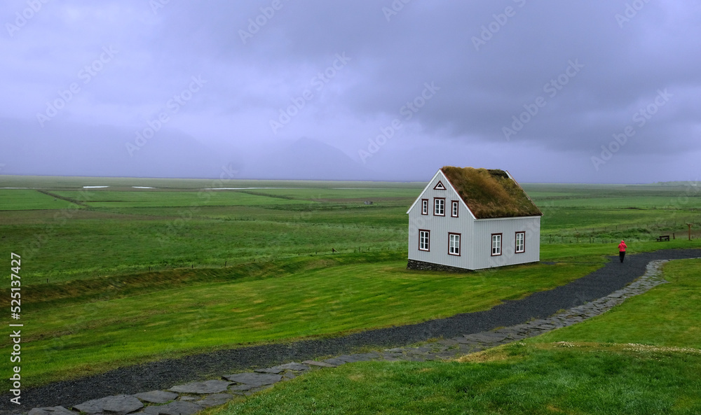 Lonely standing rural house in the boundless expanse of Iceland Lonely standing rural house in the boundless expanse of Iceland