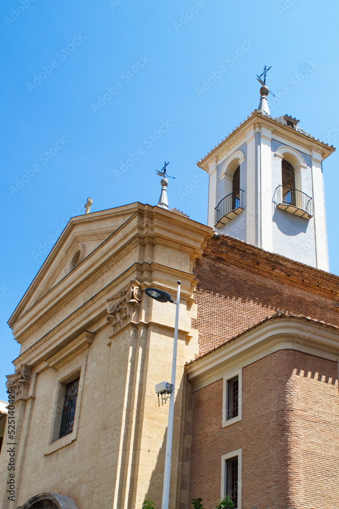 Parish Church of Saint Lawrence in Murcia with facade, bell tower and dome on a sunny day