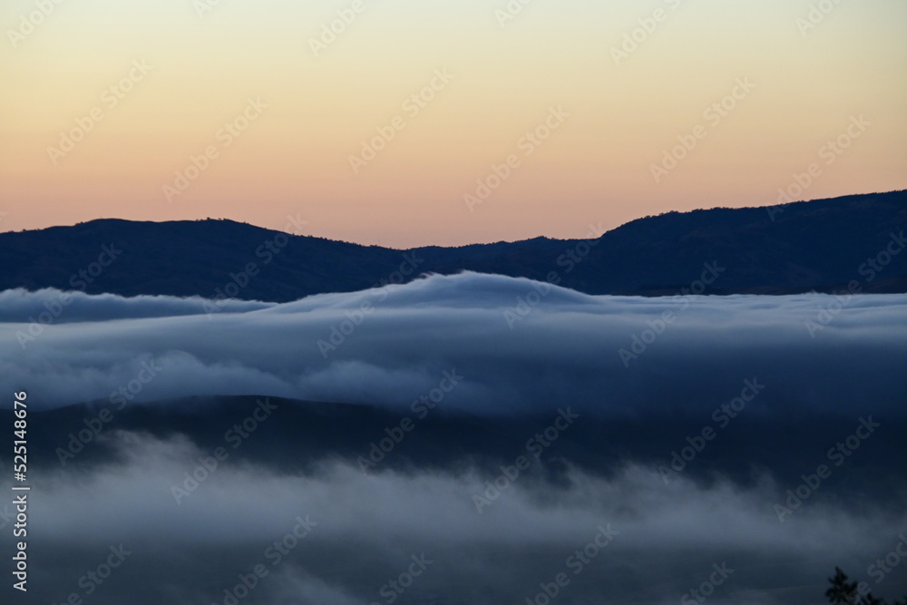 rolling clouds in hills