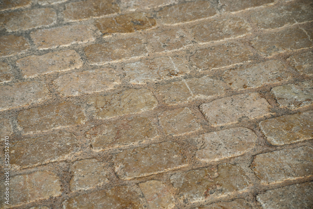 Closeup of ancient cobbles on the floor in the street Closeup of ancient cobbles on the floor in the street