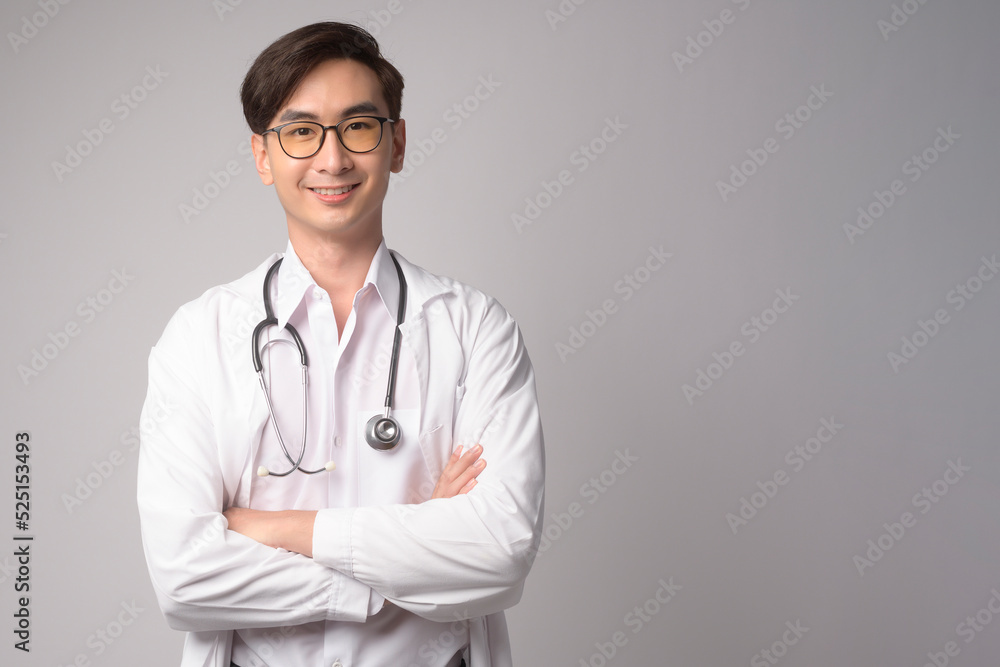 Portrait of male confident doctor over white background studio, healthcare and Medical technology concept.