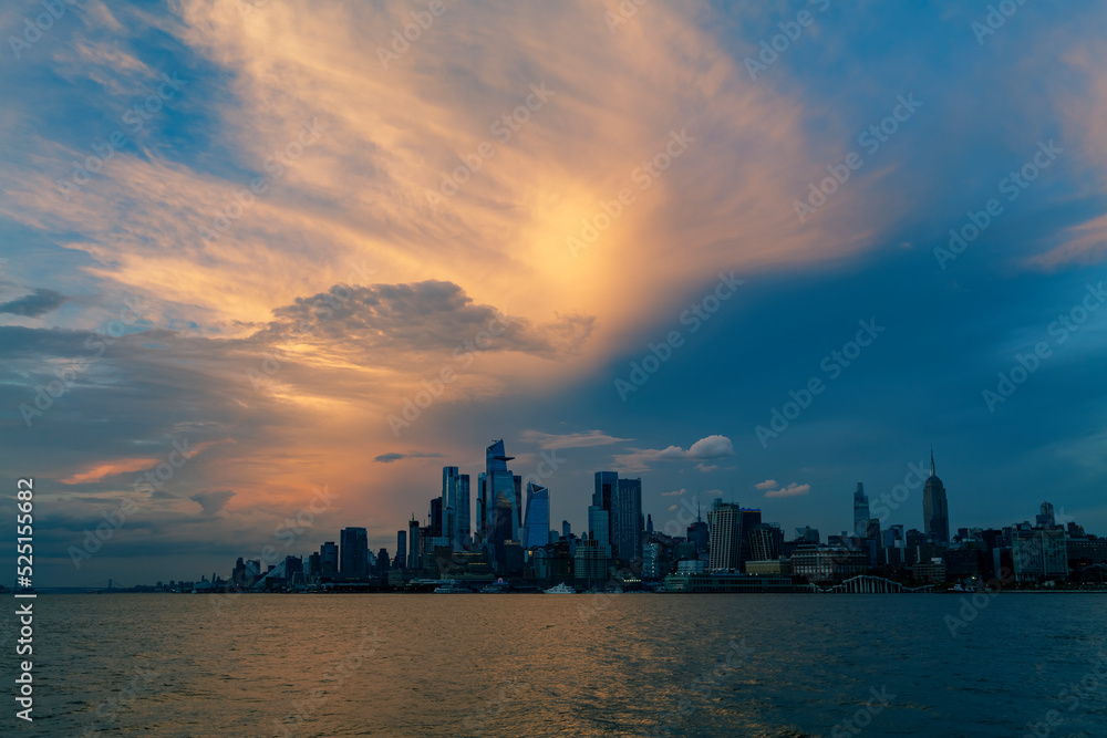 Sunset View to Manhattan skyline Hudson Yards skyscrapers, from Weehawken Waterfront in Hudson River at sunset. High quality photo
