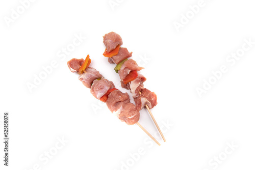 Raw meat and vegetable skewer, isolated on white background. In gastronomy, brochette (from the French brochette, meaning 